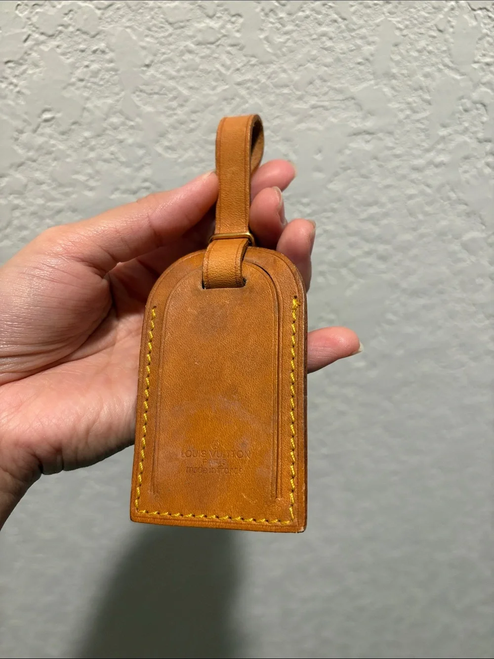 Louis Vuitton leather luggage tag.